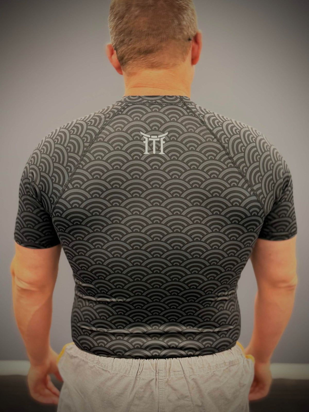 Back view of Mat Theory I Suck at Jiu Jitsu rashguard